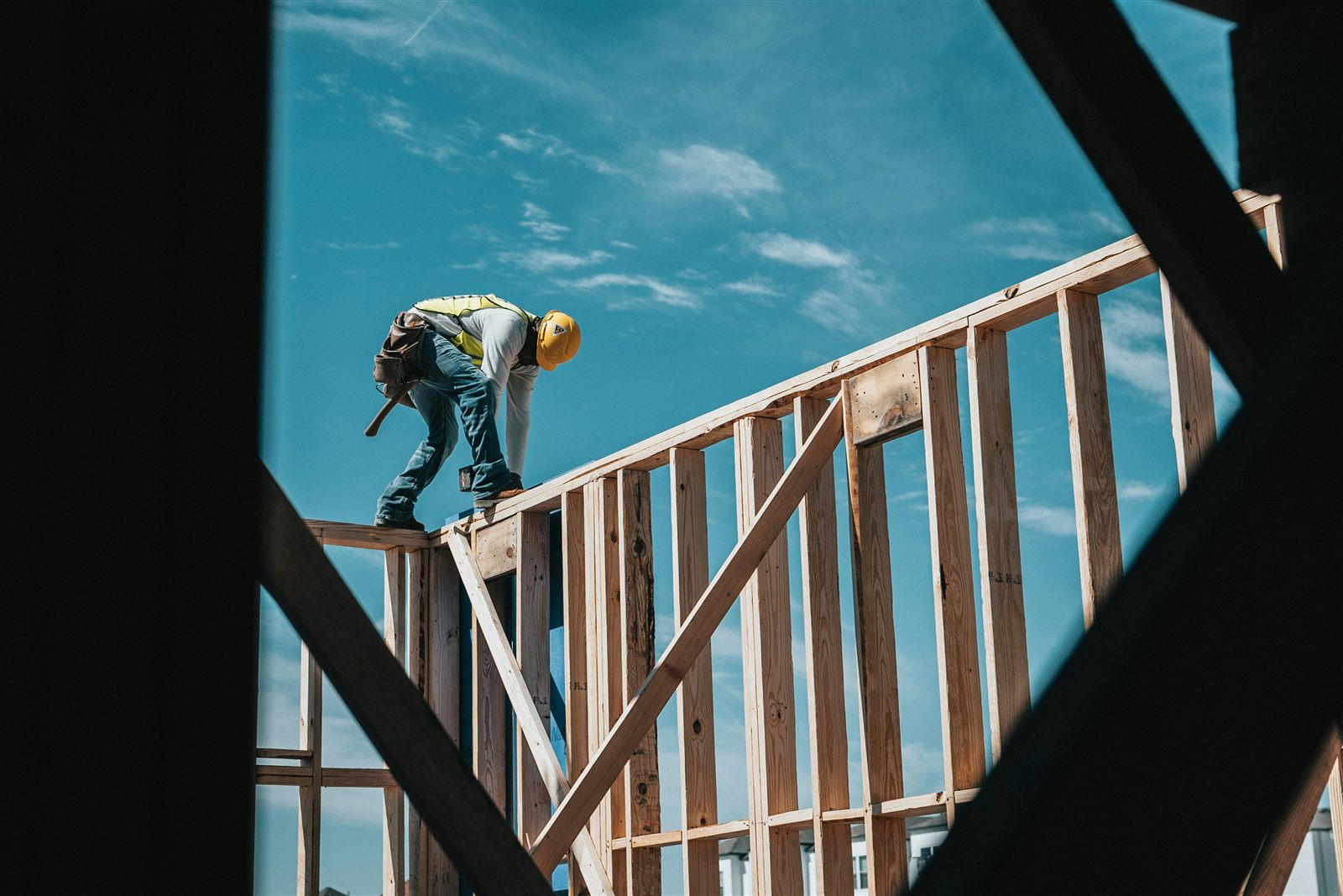 Builder working on the timber frame of a house